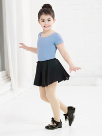 a little girl wearing Ballet Dance shoes and a costume