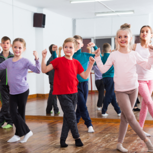 Little girls and boys in a dance class